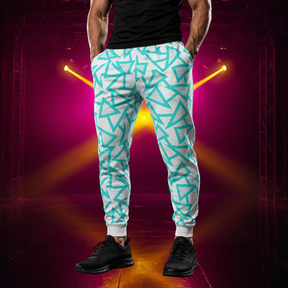 Man wearing jogging pants in a retro blue triangular geometric design in blue against a pale grey background.