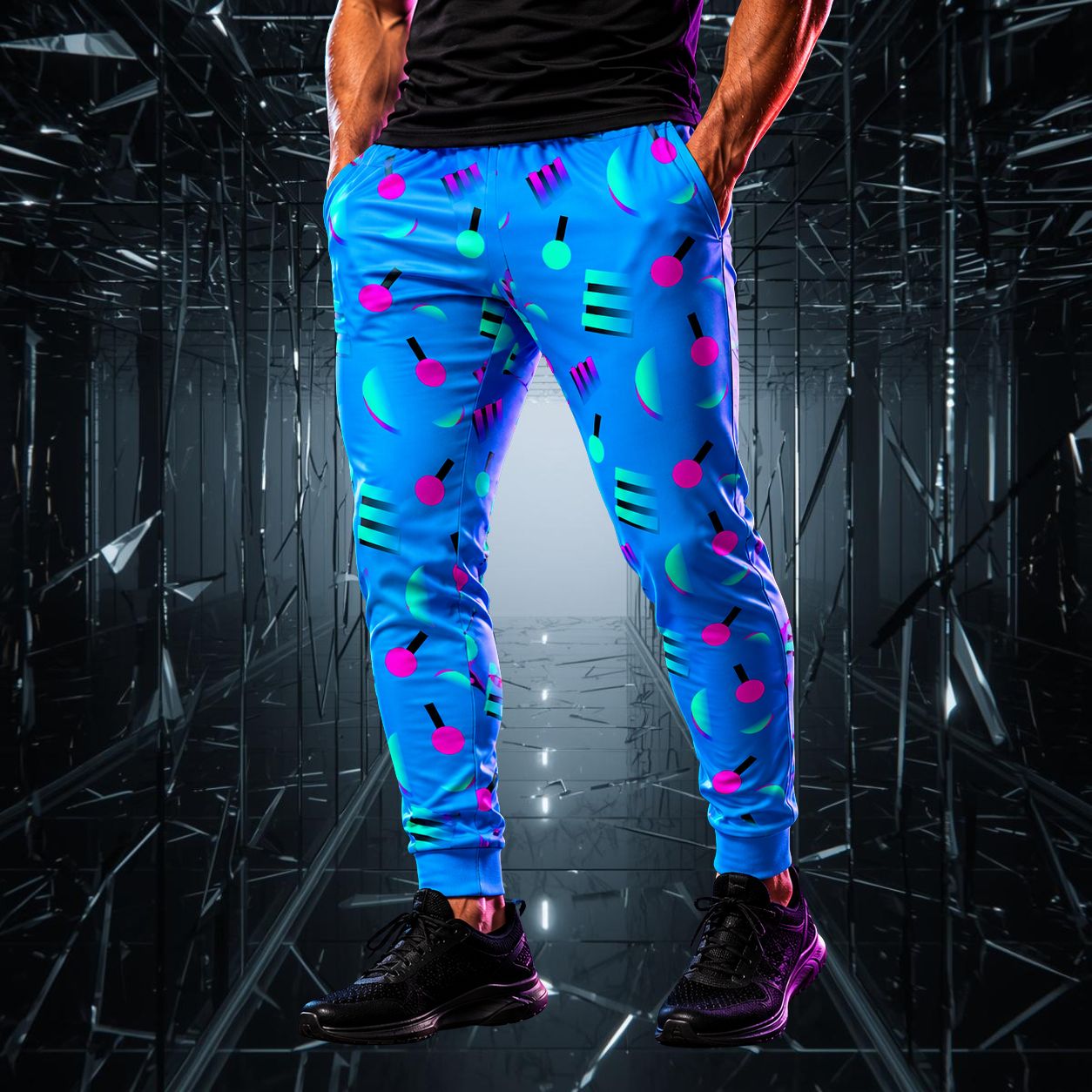Person wearing blue memphis style jogger pants with colorful geometric patterns in a reflective, dark environment