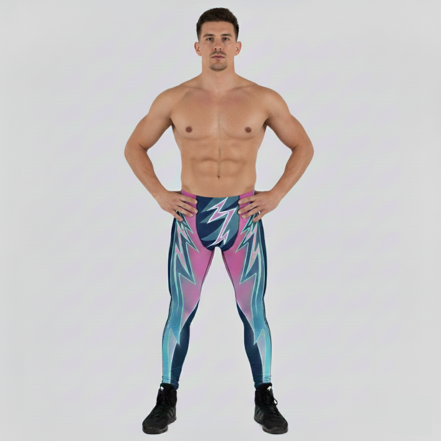 Man wearing colorful wrestling tights with a geometric pattern on a white background