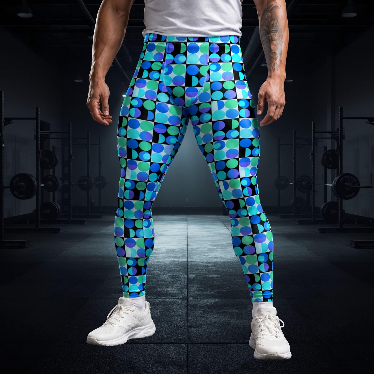 Man wearing athletic leggings in blue geometric design with white trainers