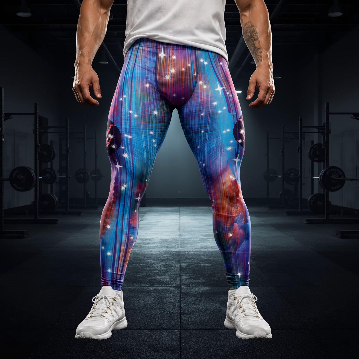 man wearing blue galaxy patterned leggings with eagle motif on each side in darkened gym