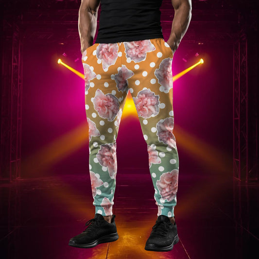 Person wearing rose floral polka dot jogger pants on a dark background with neon lights.