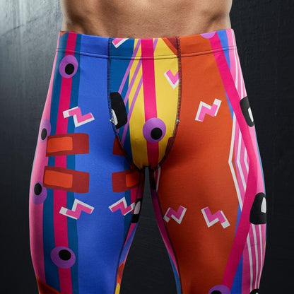 Colorful athletic wrestling tights with geometric 80s memphis patterns on a black background