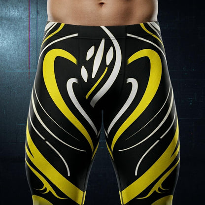 Black and yellow patterned swim briefs on a dark background - closeup - front