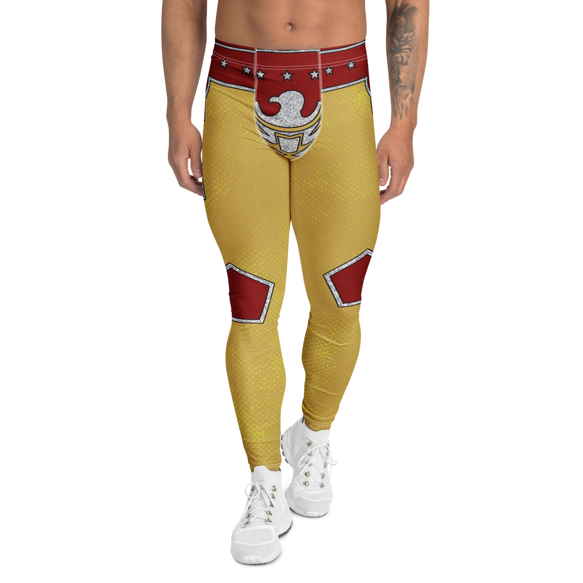 Person wearing patriotic gold wrestling pants with, silver eagle, red accents and a red shirt against a white background