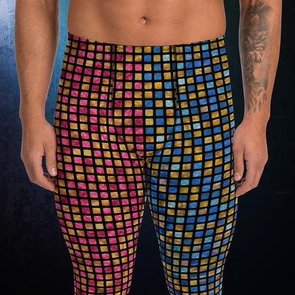 Multicolored checkered wrestling pants worn by a person on a dark background