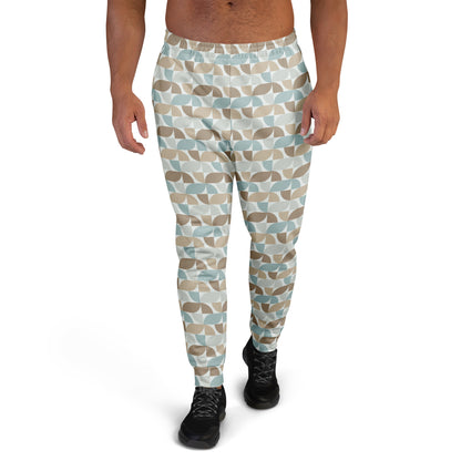 Person wearing  pastel geometric patterned pants on a white background