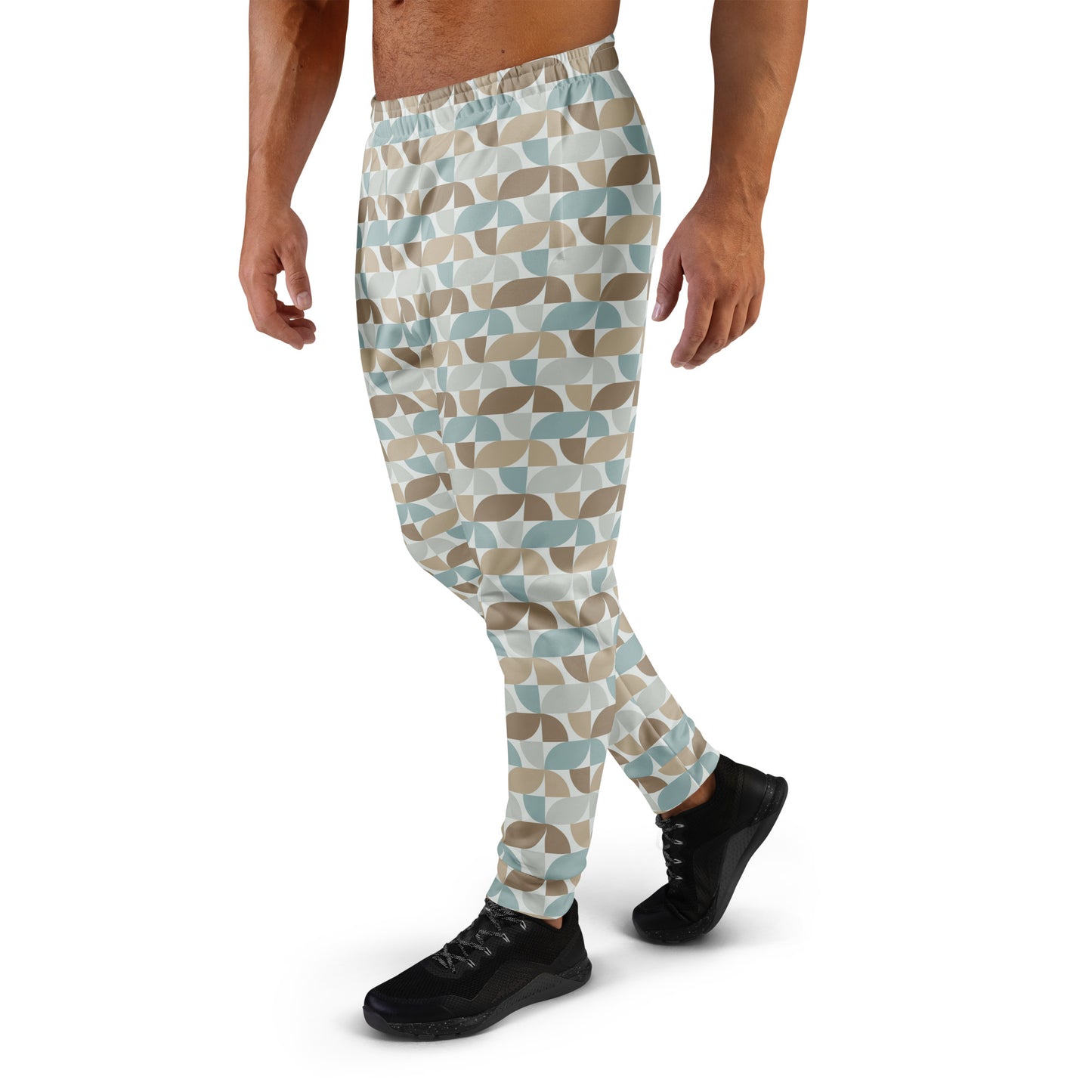 Person wearing  pastel geometric patterned pants on a white background