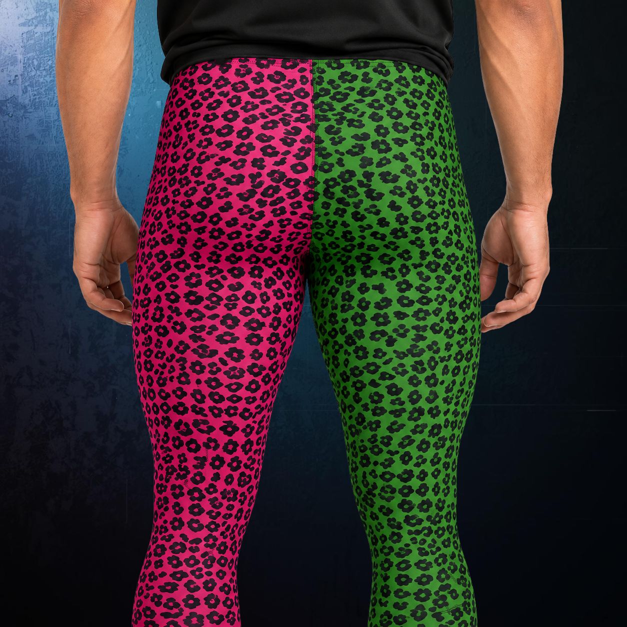 Closeup of men's leggings in split pink and green leg design with black leopard skin overlay, closeup rear view