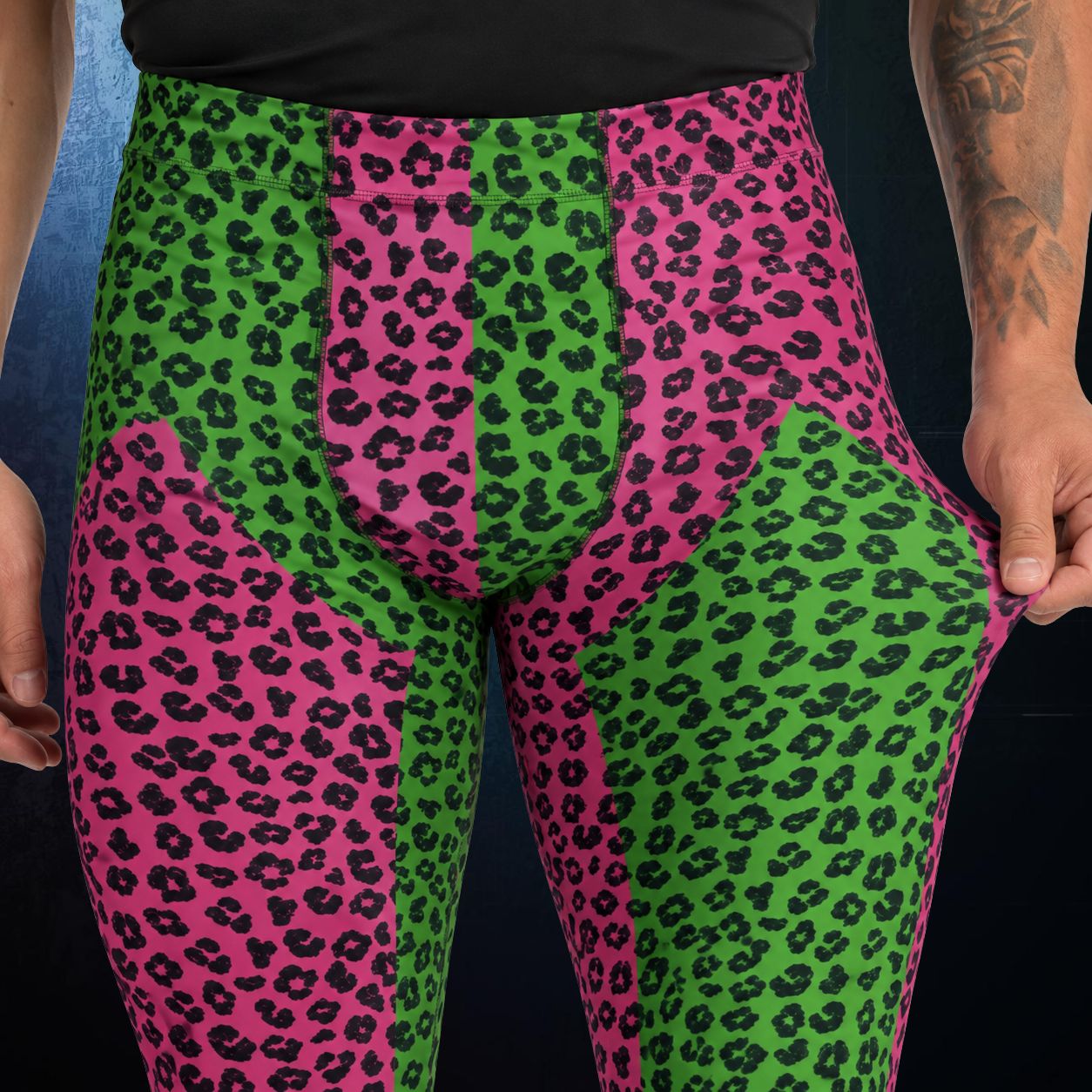 Men's wrestling tights with pink and green leopard print pattern in closeup