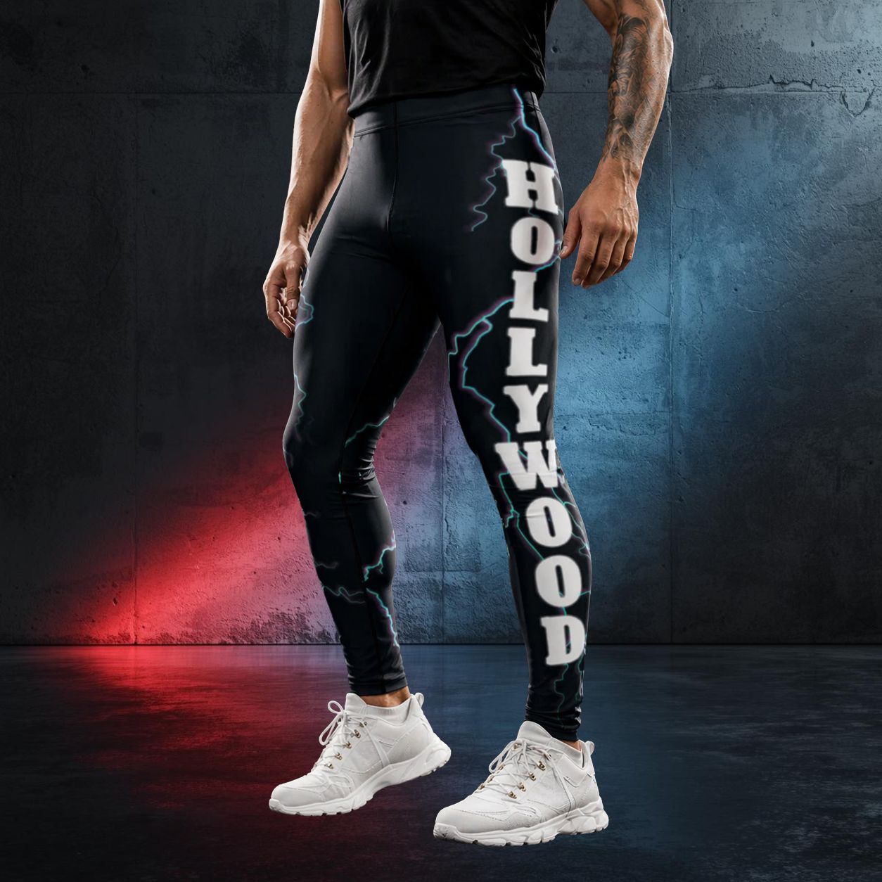 Person wearing black leggings with 'Hollywood' and lightning print against a dark concrete background with American flag colors