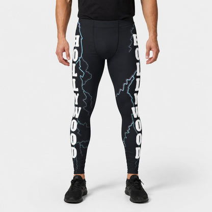 Person wearing black leggings with 'Hollywood' text and lightning designs on a white background