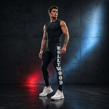 Man wearing black tank top and leggings with 'Hollywood' print with vibrant blue lightning in a dark room with red and blue lighting.
