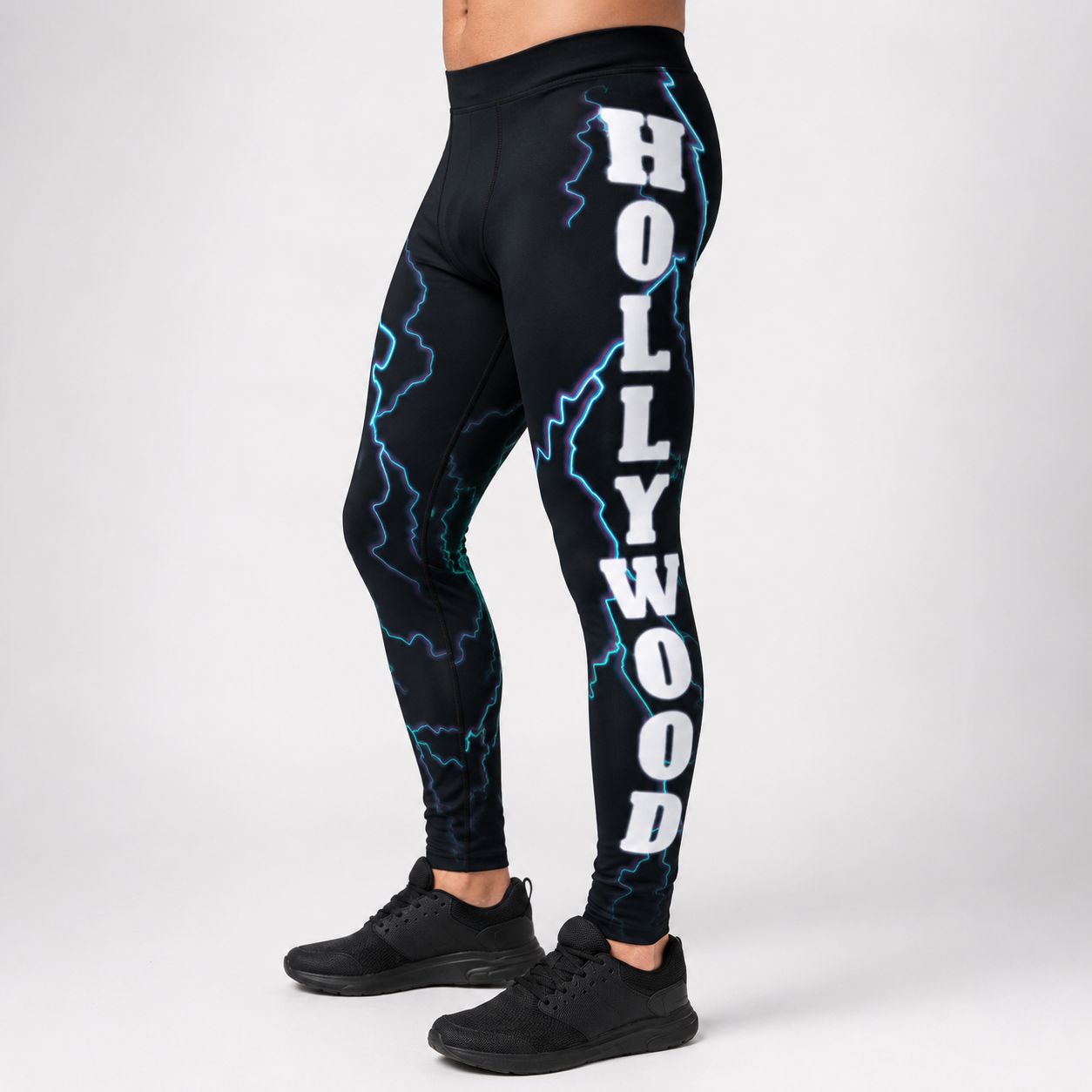 Black leggings with 'Hollywood' text and lightning designs on a white background