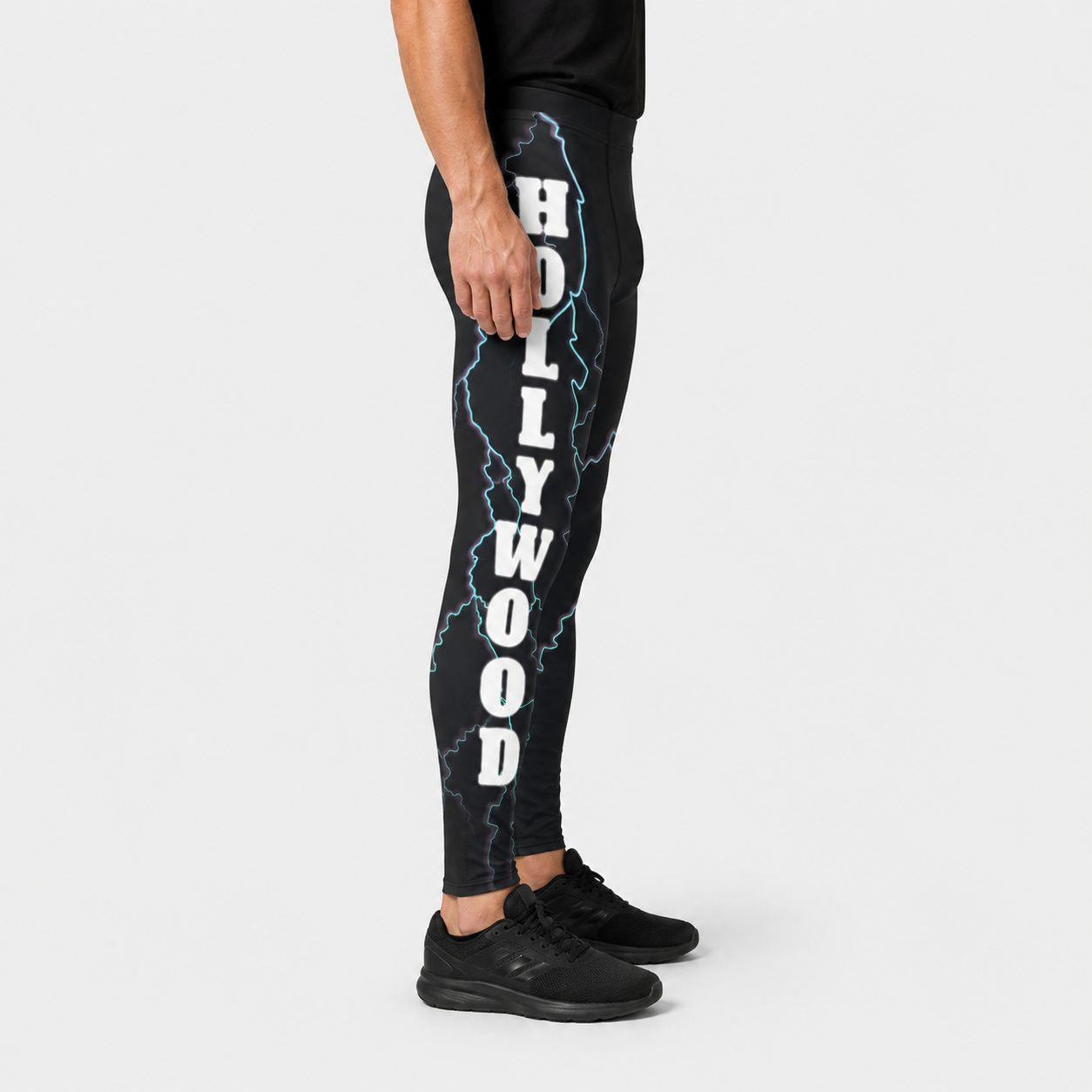 Black leggings with 'Hollywood' text and lightning design on a white background