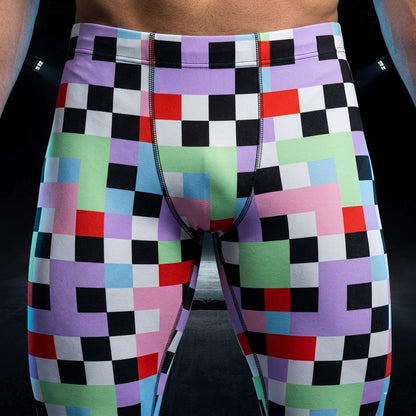 Colorful checkered shorts with a geometric pattern on a black background