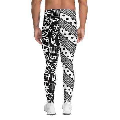 Man wearing black and white geometric patterned pro wrestling tights on a white background