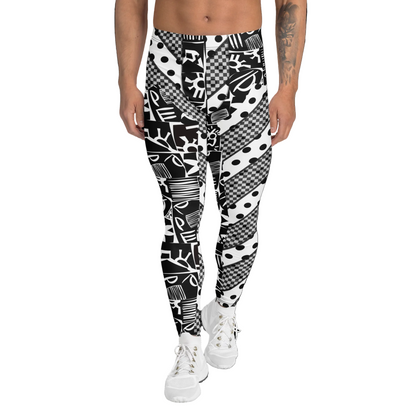 Man wearing black and white geometric and polka dot patterned pro wrestling tights on a white background