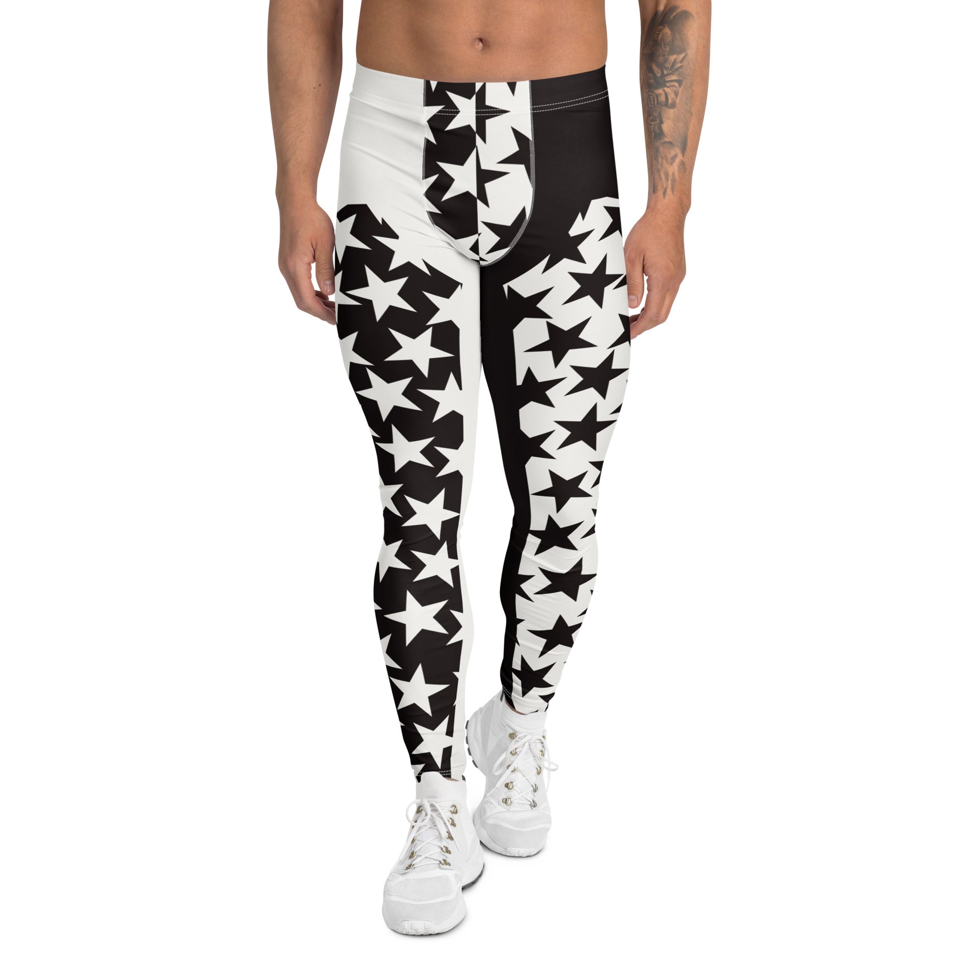 Person wearing black and white star-patterned leggings on a white background