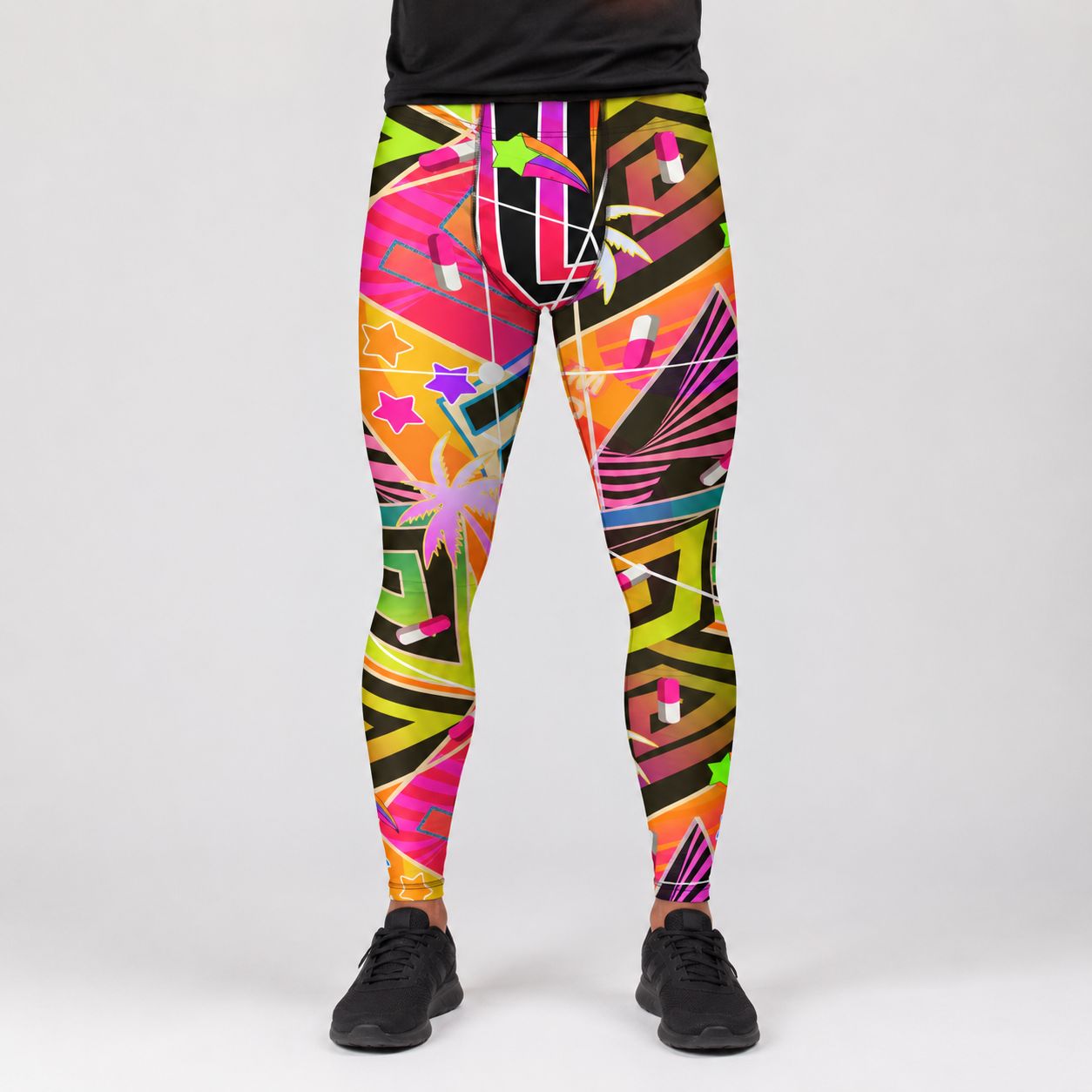 A person wearing colorful geometric print leggings with a black top and black sneakers, shown from the waist down against a light gray studio background.
