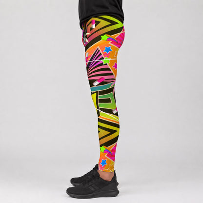 A person wearing colorful geometric patterned leggings and black sneakers, shown from the waist down against a light gray studio background.