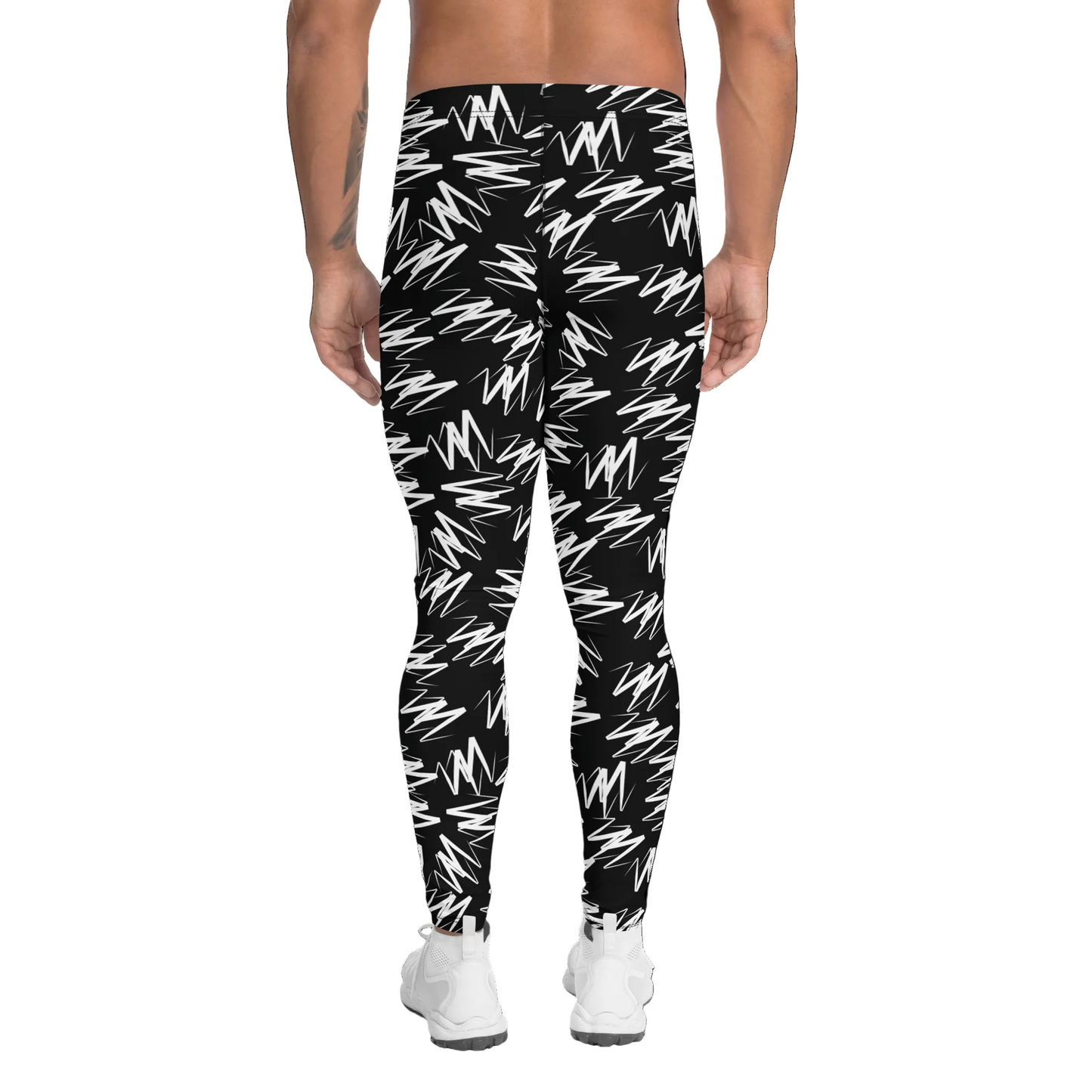 Black leggings with white abstract pattern worn by a person on a white background