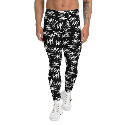 Person wearing black and white patterned leggings on a white background