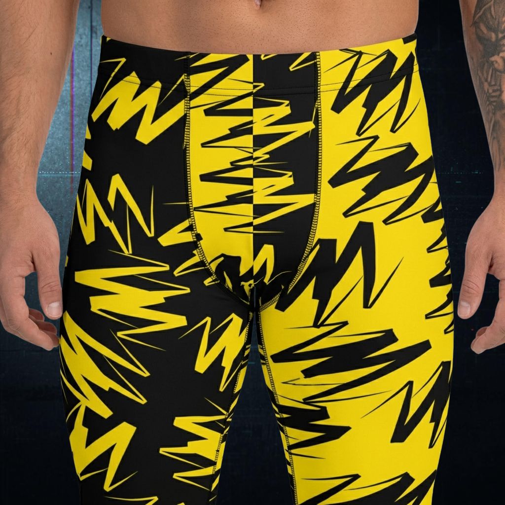 Black and yellow patterned men's wrestling tights closeup view.