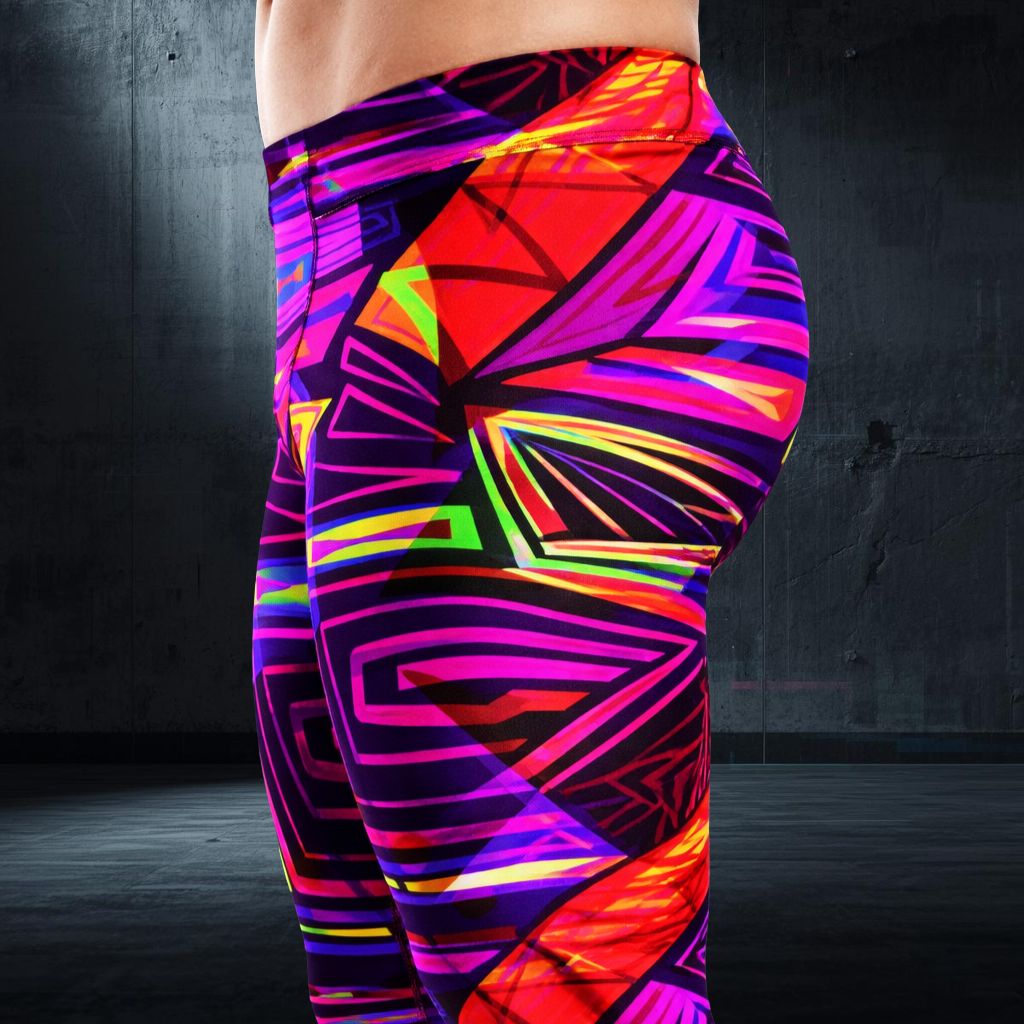 Colorful geometric-patterned leggings worn by a person against a dark background