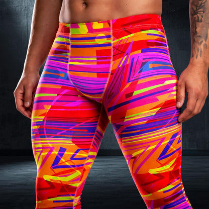 Colorful athletic leggings with abstract pattern worn by a person on a dark background