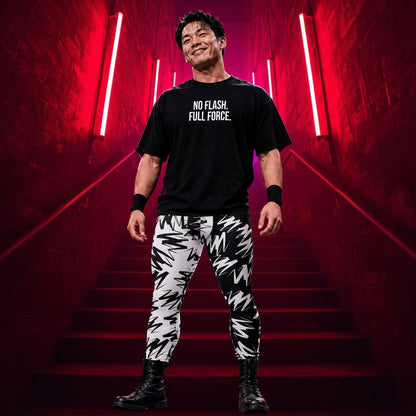 Man wearing black No Flash. Full Force. wrestling t-shirt with black and white geometric pro wrestling tights