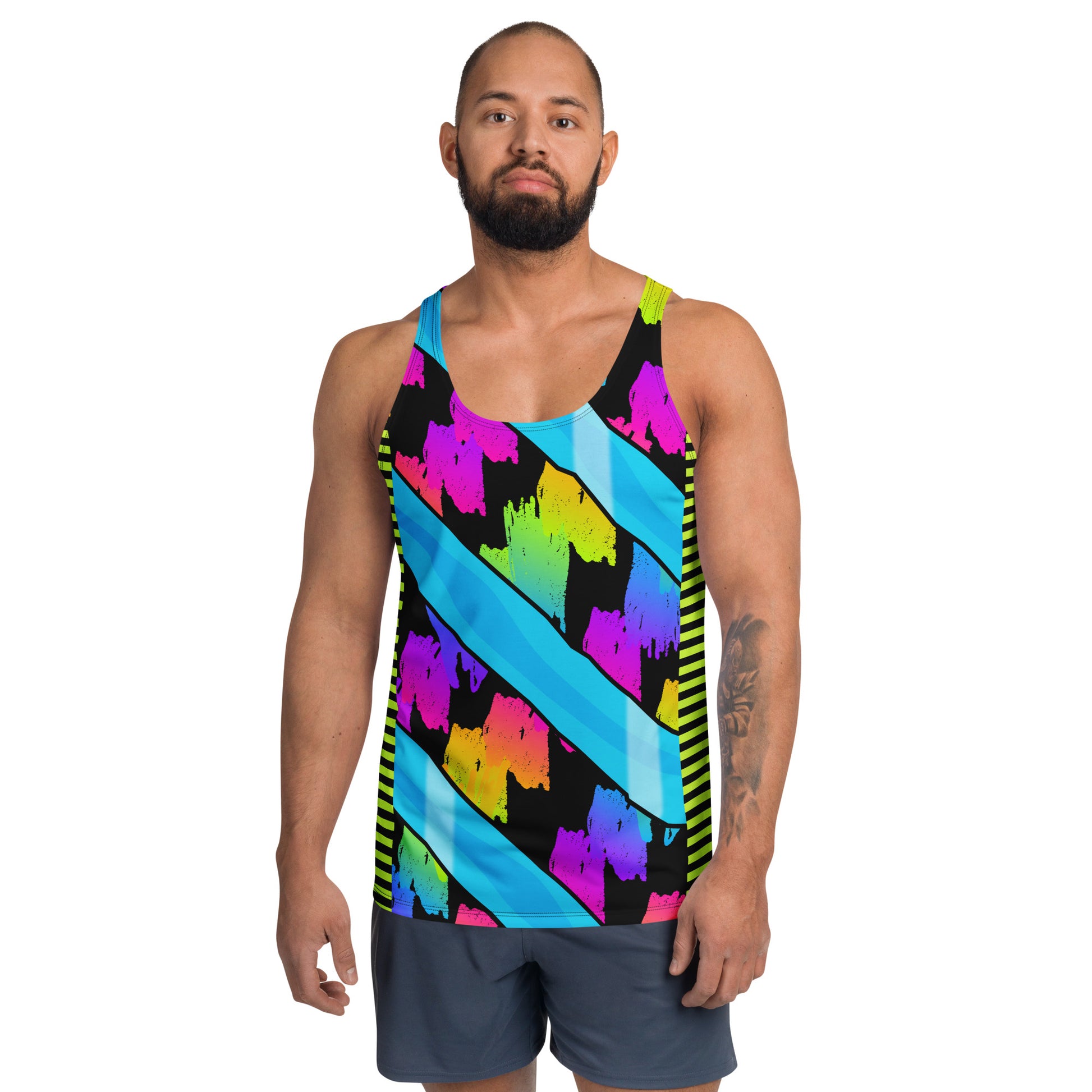 Man wearing a colorful pro wrestling style tank top with rainbow geometric pattern.