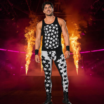 Man in black and white star patterned wrestling cosplay outfit with split design standing in front of fiery background