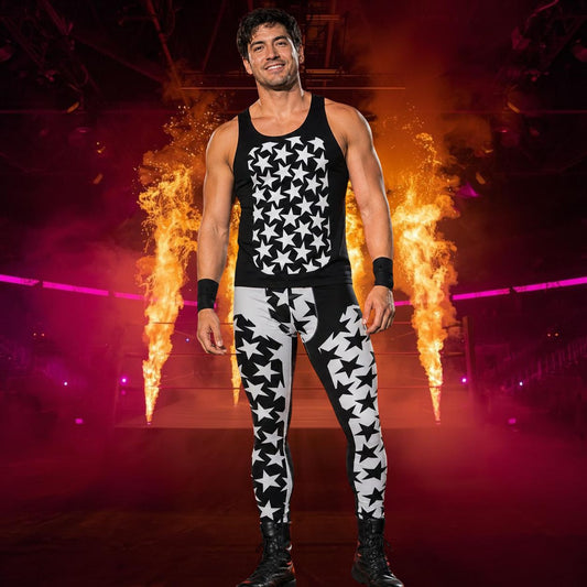 Man in black and white star patterned wrestling cosplay outfit with split design standing in front of fiery background