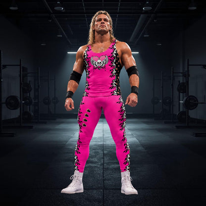 Person wearing pink pro wrestling tights for men in black or pink with fire and hearts. Matching tank top with skull and wings and a heart. Pink, black.