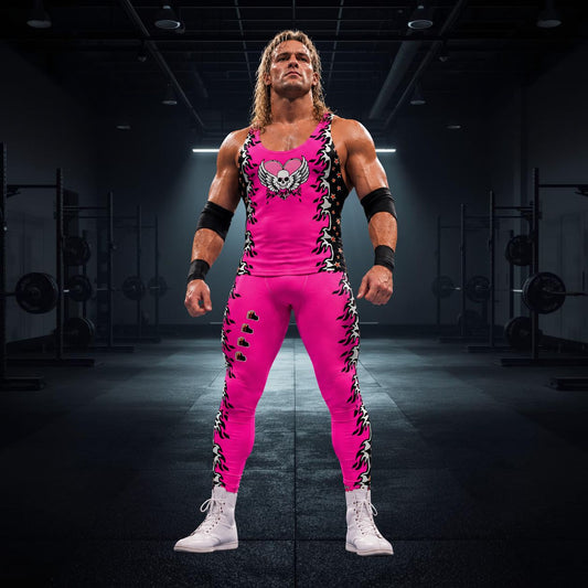 Person wearing pink pro wrestling tights for men in black or pink with fire and hearts. Matching tank top with skull and wings and a heart. Pink, black.