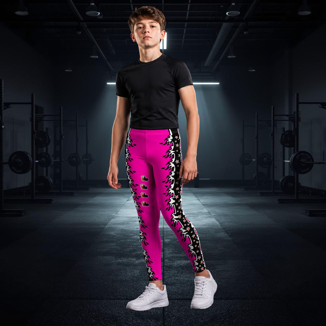 Person wearing bright pink leggings with black fire and star patterns in a gym setting