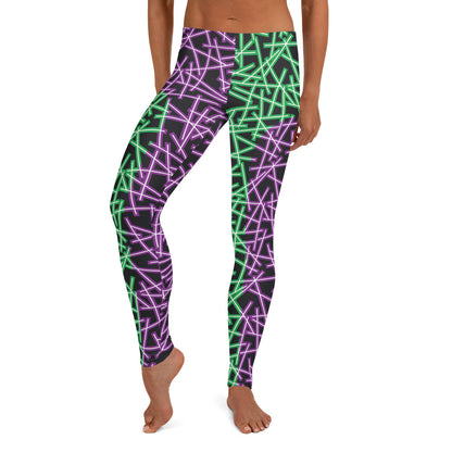 Neoncore style leggings for women with scattering pattern of neon stripes in green and purple on these printed pro wrestling style tights. Mid rise elasticated waistband and ankle length legs in opposite colors with reverse insets.