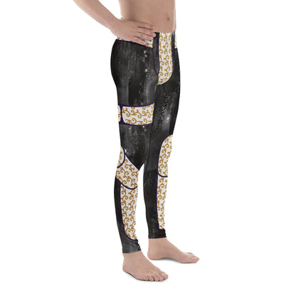 Person wearing black wrestling tights with gold brocade style and printed eagle design on a fiery background