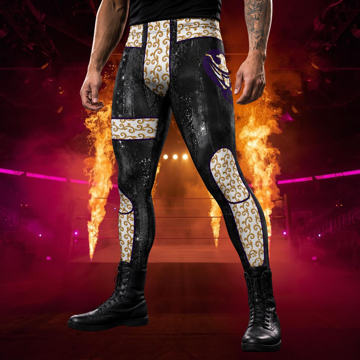 Person wearing black wrestling pants with gold brocade style and printed eagle design on a fiery background