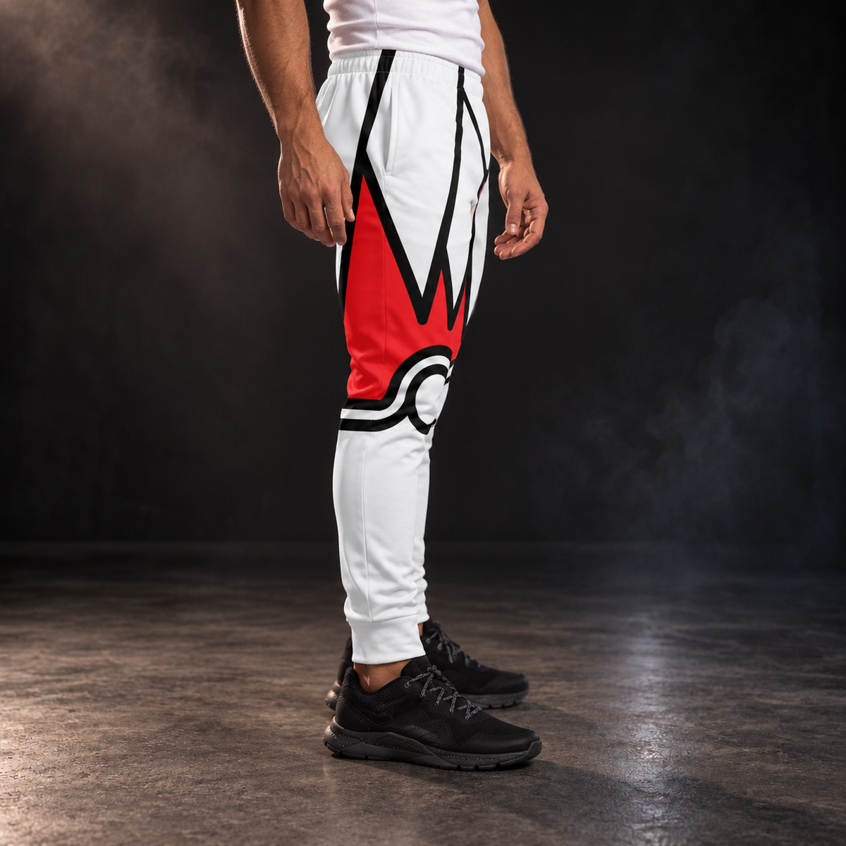Side view of the Crimson Crest wrestling joggers - red crest peaks and black-ringed knee on white