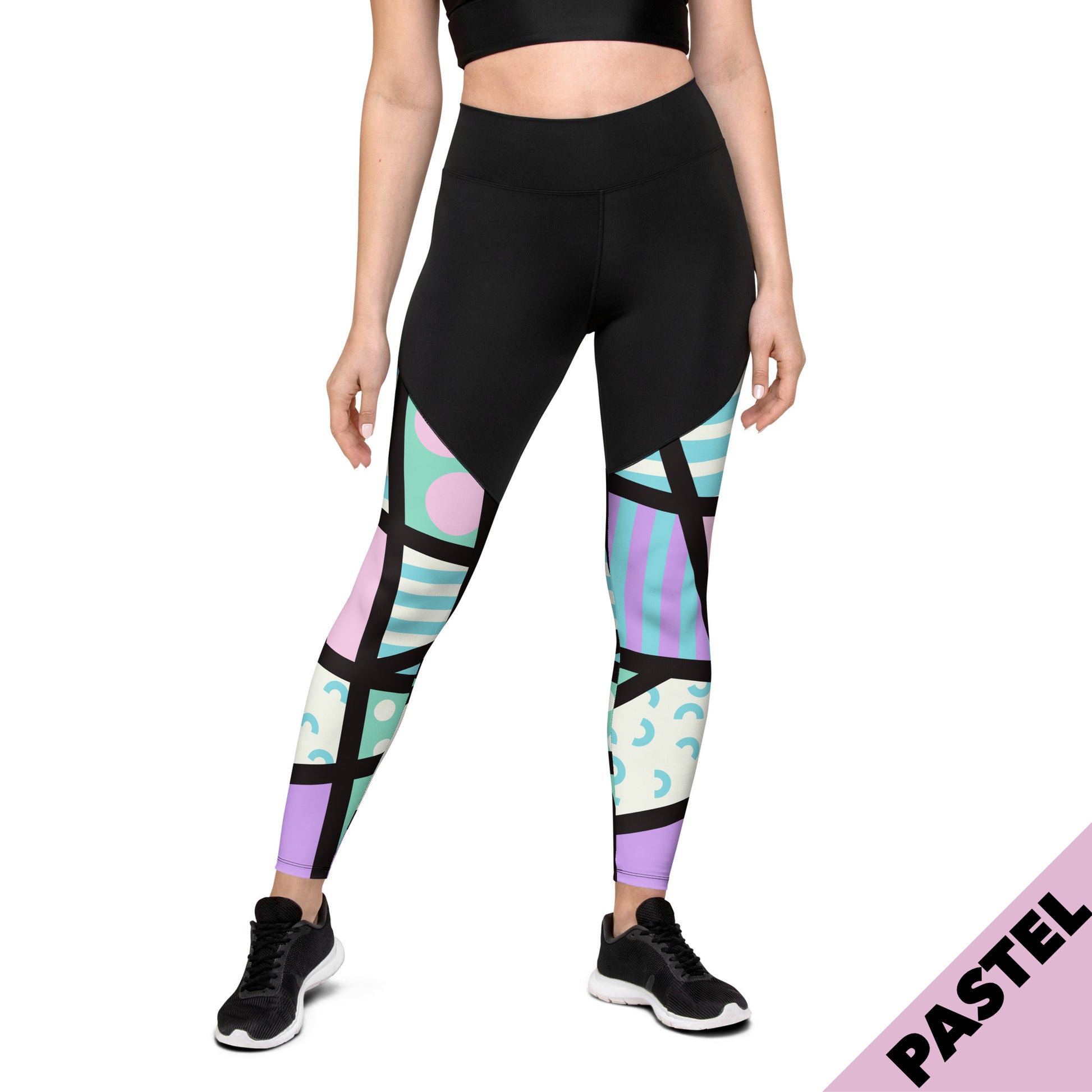 Sports leggings for women with black upper top and geometric pastel pink and blue patterned legs. Compression ankle length gym leggings with high elasticated waistband. Non-see through and squat proof leggings.