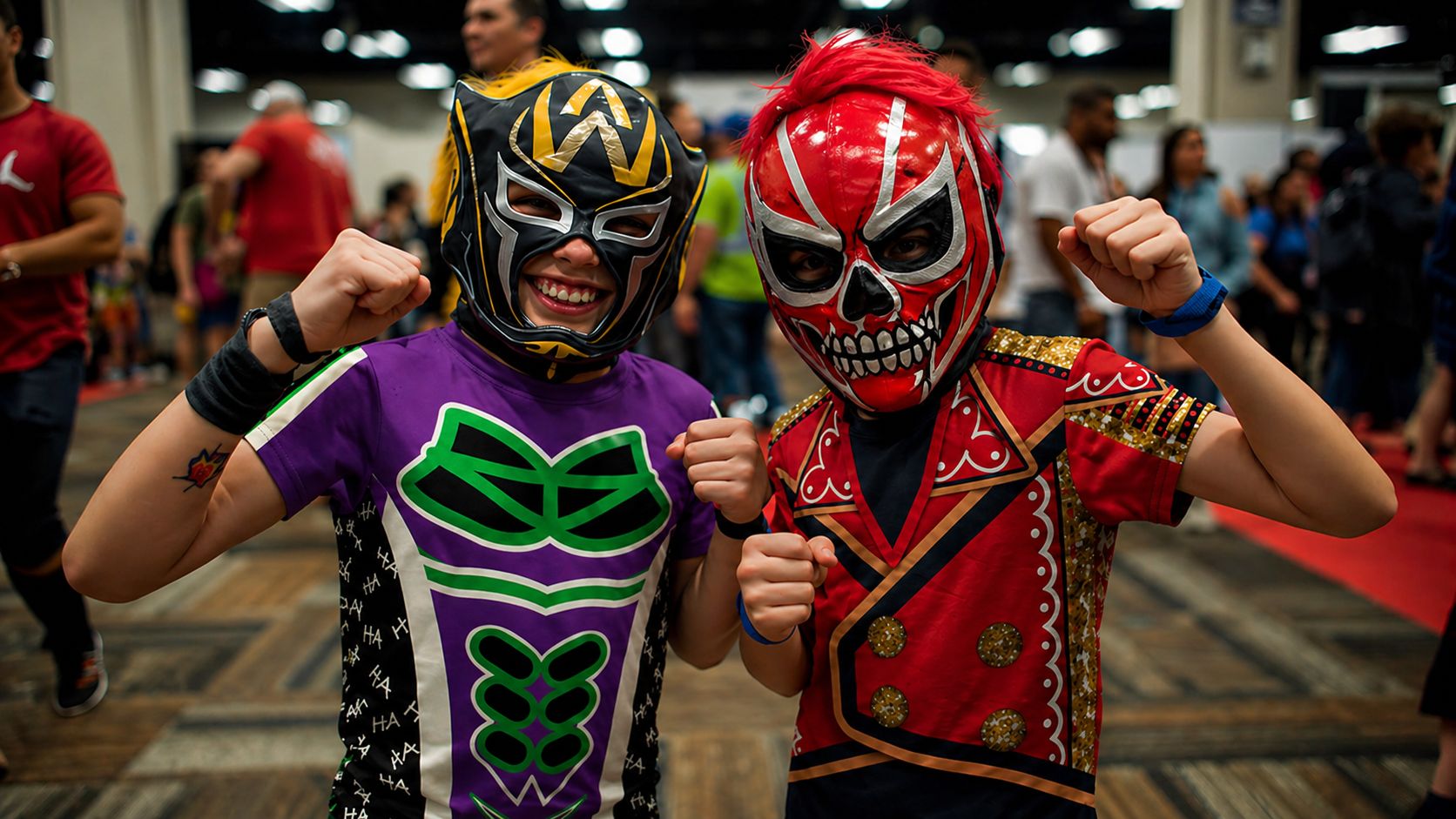
                Two boys wearing wrestling-inspired cosplay outfits at a convention hall
              