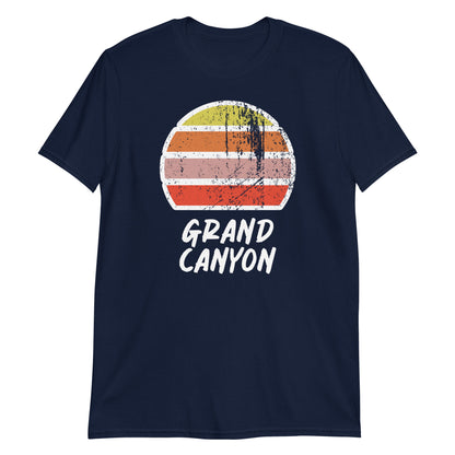 vintage sunset grand canyon graphic cotton t-shirt, with short sleeves and crew neck. Stylised setting sun in a distressed effect in retro colors yellow, orange, pink and above the words Grand Canyon on this navy tee by BillingtonPix.