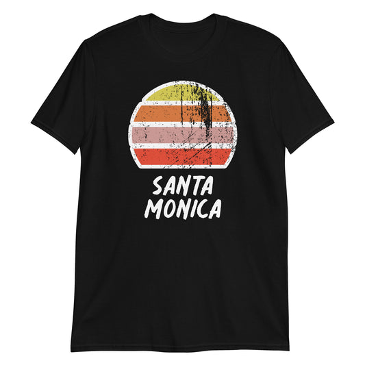 vintage sunset santa monica graphic cotton t-shirt, with short sleeves and crew neck. Stylised setting sun in a distressed effect in retro colors yellow, orange, pink and above the words Santa Monica on this black tee by BillingtonPix.