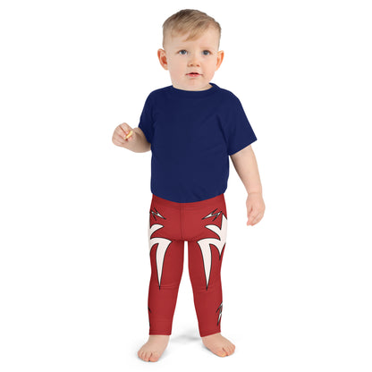 Child wearing bright red cosplay leggings with bold white lightning bolt graphics, inspired by superhero and wrestling styles.
