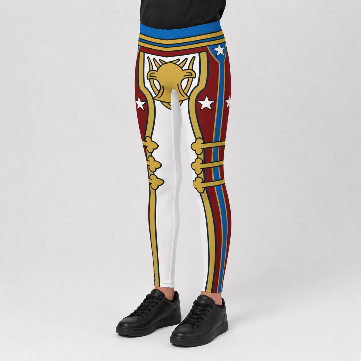 A youth wearing cosplay wrestling tights with a retro style multicolor graphic print inspired by British military, paired with black sneakers, shown against a light gray studio background.