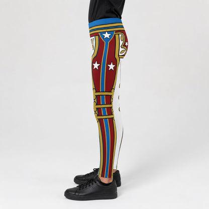 A person shown from the waist down wearing cosplay wrestling tights with a bold multicolor retro military American superhero-style print featuring red, blue, gold, and white panels with stars, paired with black sneakers on a light gray studio background.