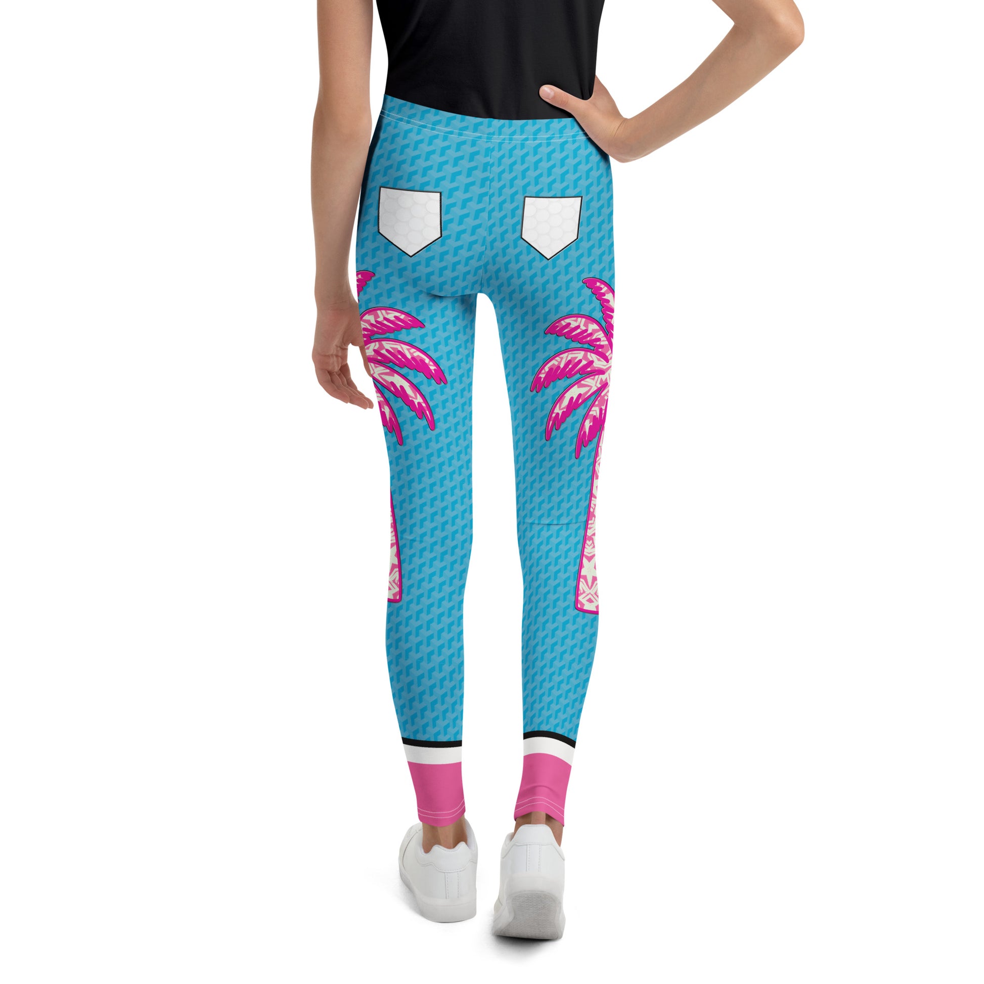 Youth wearing blue and pink Retro Palm Hero cosplay leggings with palm tree graphics.