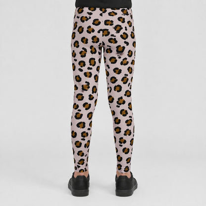 A person shown from the back wearing leopard-print leggings with black shoes, photographed against a clean light gray studio background.